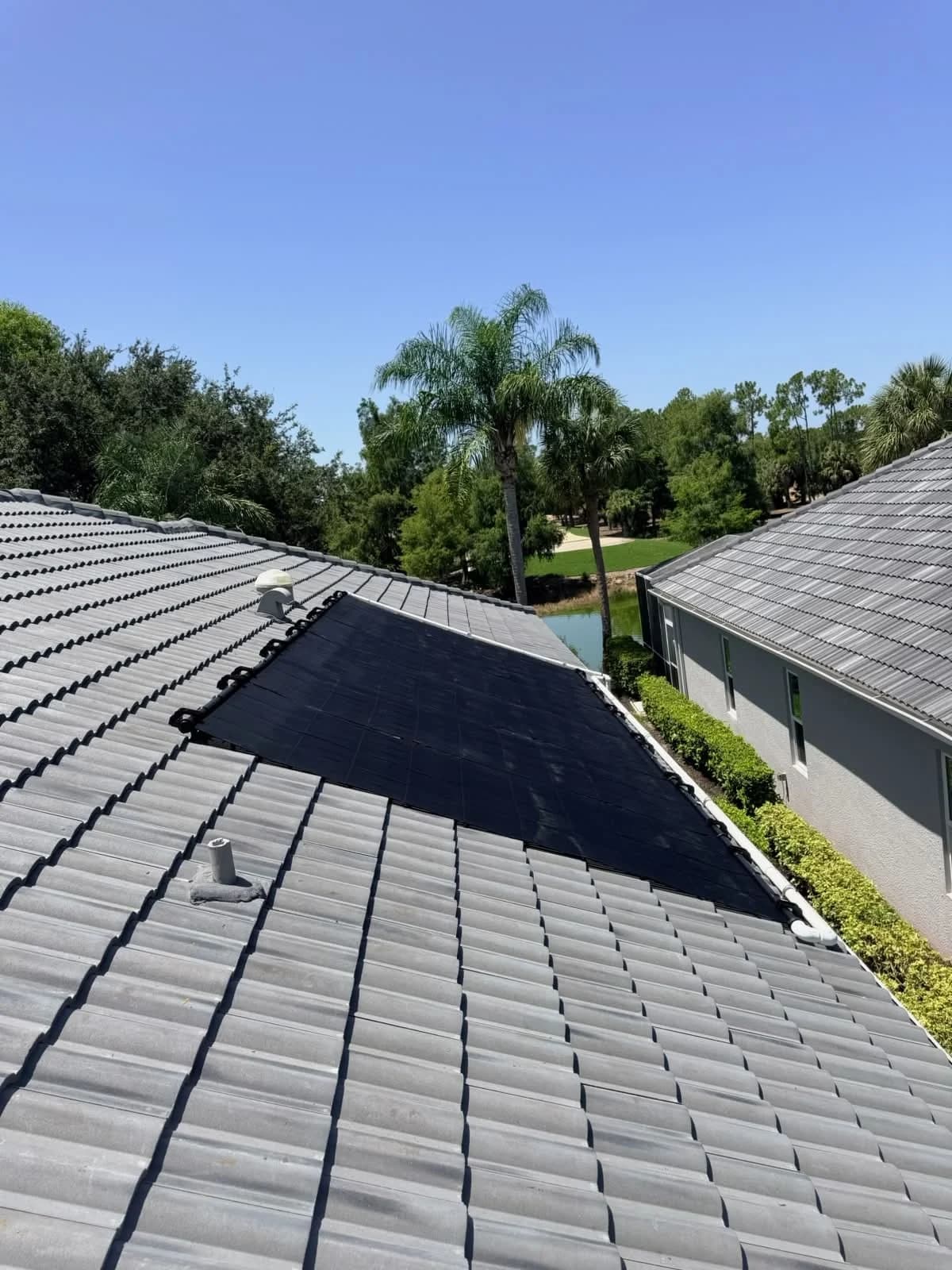 Solar pool heating collectors installed on a Florida roof
