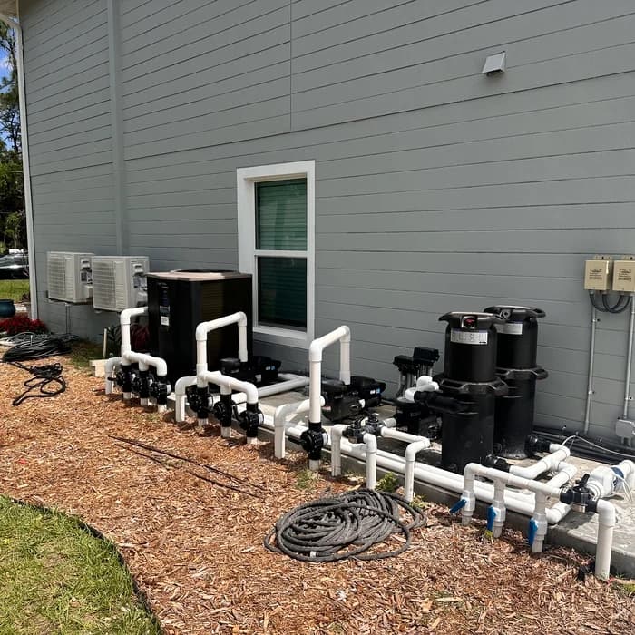 Hayward pool heat pump installed beside filters on a re-plumbed equipment pad in Florida